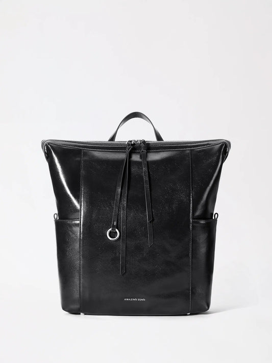 AMAZING SONG donut backpack large in genuine leather standing upright on a neutral background