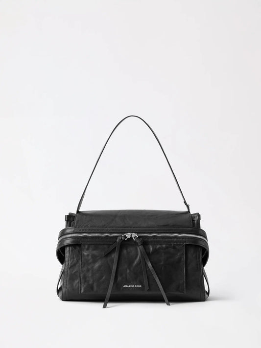 Cream white leather cheese roll briefcase with structured top handle and rolled pastry-inspired edges