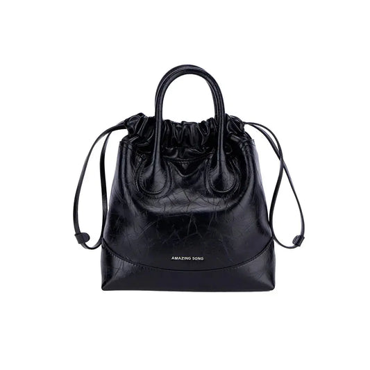 A slouchy crescent hobo bag in warm tan top-grain leather