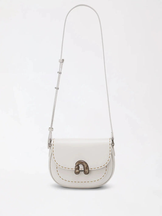 chestnut-brown rounded top-handle bag with a soft matte finish