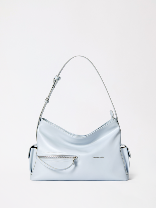 The Liqueur Fang Hobo Bag shown in top-grain cowhide with its signature corner tooth detail