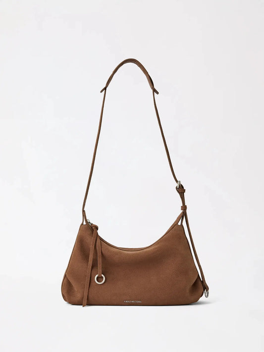 A small slouchy donut hobo bag in soft tan cowhide leather