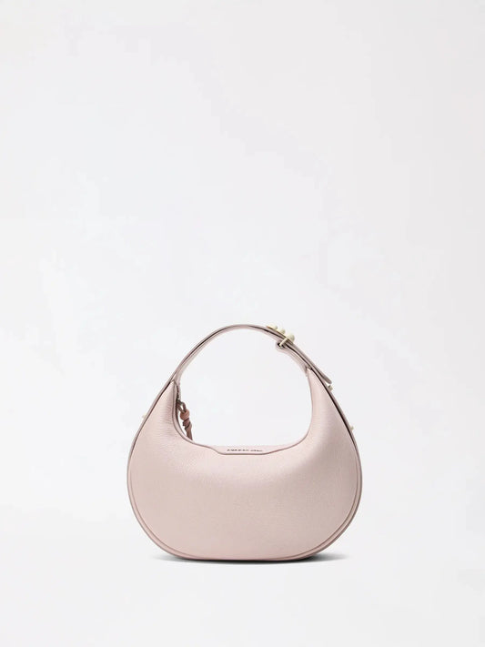 A small smooth top-grain leather half-moon bag in warm cream on a neutral background