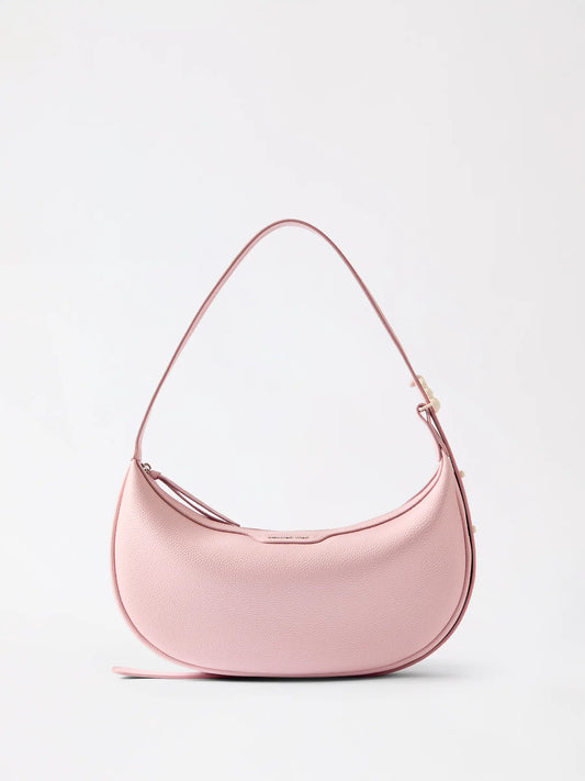 A half moon leather bag whose clean curved contour reads from across a room