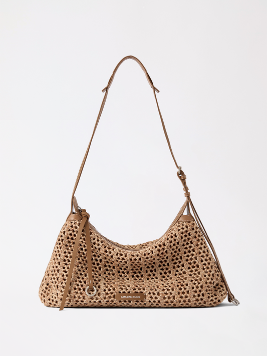 Large woven donut hobo bag in top-grain cowhide with structured soft shape