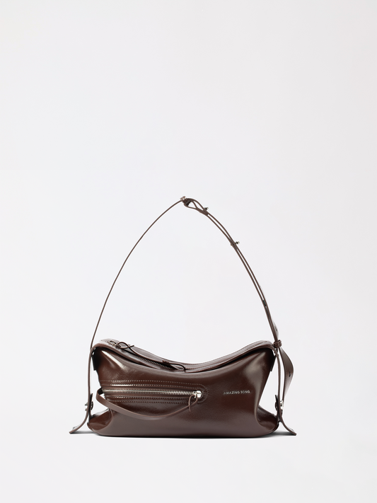 Structured liqueur shaped leather top handle bag in warm tan top grain cowhide