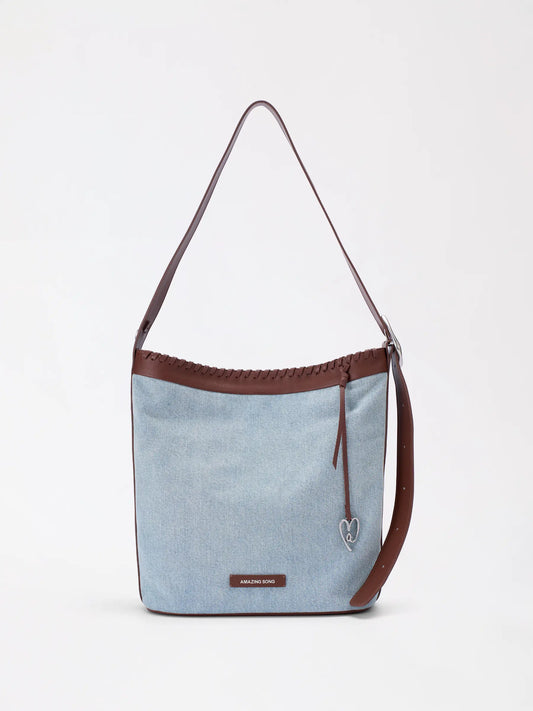 Woven genuine leather bucket bag with braided strips and a soft rounded body
