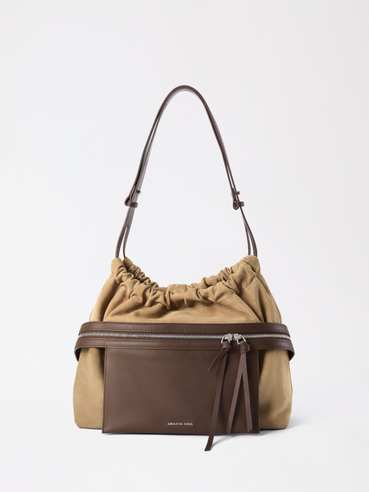 Cheese roll hobo bag in top-grain cowhide shown from the front with its soft slouchy silhouette