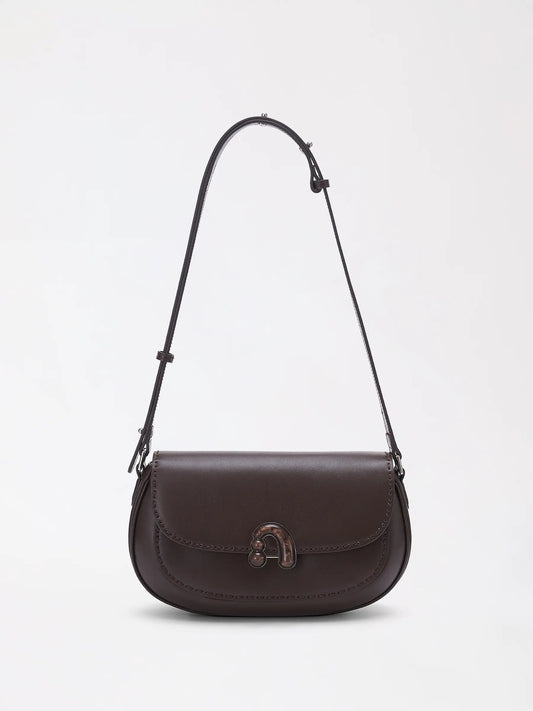 Chestnut brown genuine leather shoulder bag photographed at a slight angle to show the natural grain