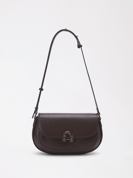 Large chestnut top-grain leather bag with a soft rounded silhouette and minimal hardware