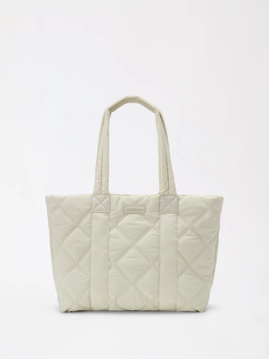 a roomy navy down-style tote bag with soft slouchy sides and wide open mouth
