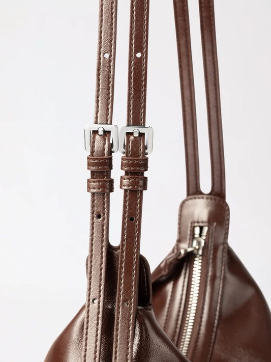 Round donut-inspired genuine leather hobo bag with ring handle, the editor's top pick for bakery-inspired bags to gift